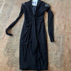 Fuzzi Italian black form fitting stretch figure flattering below knee dress